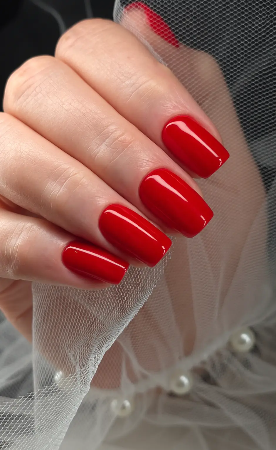 Classic red glossy manicure on short square nails