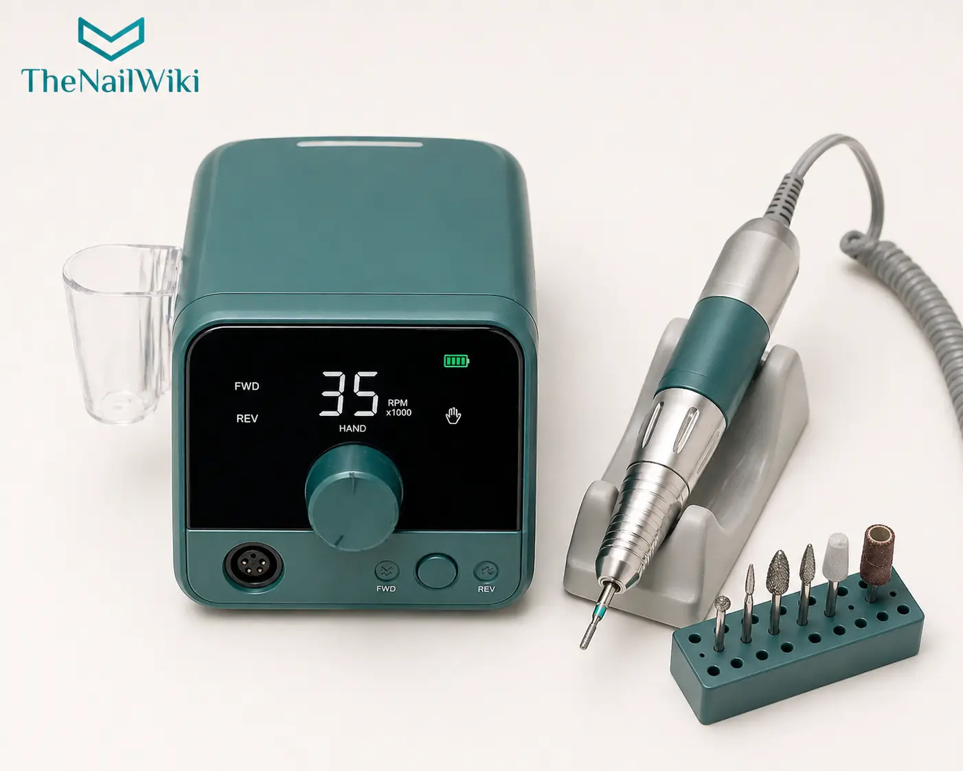 Professional desktop e-file machine with control unit and handpiece resting in its holder on a nail station