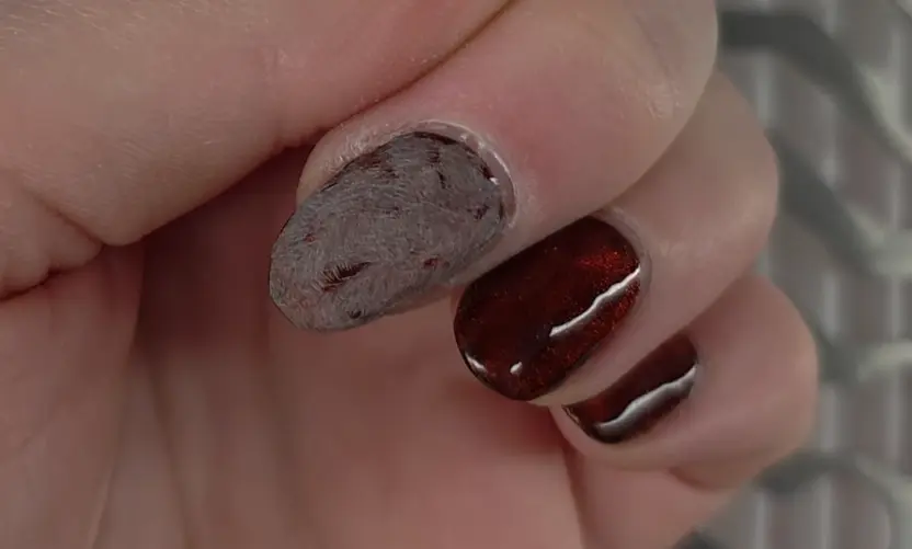 Close-up demonstration of proper filing technique showing 180-grit manual nail file removing shine from gel polish top coat without reaching natural nail