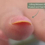 Close up of gel nail lifting showing separation between gel product and natural nail plate with visible gap