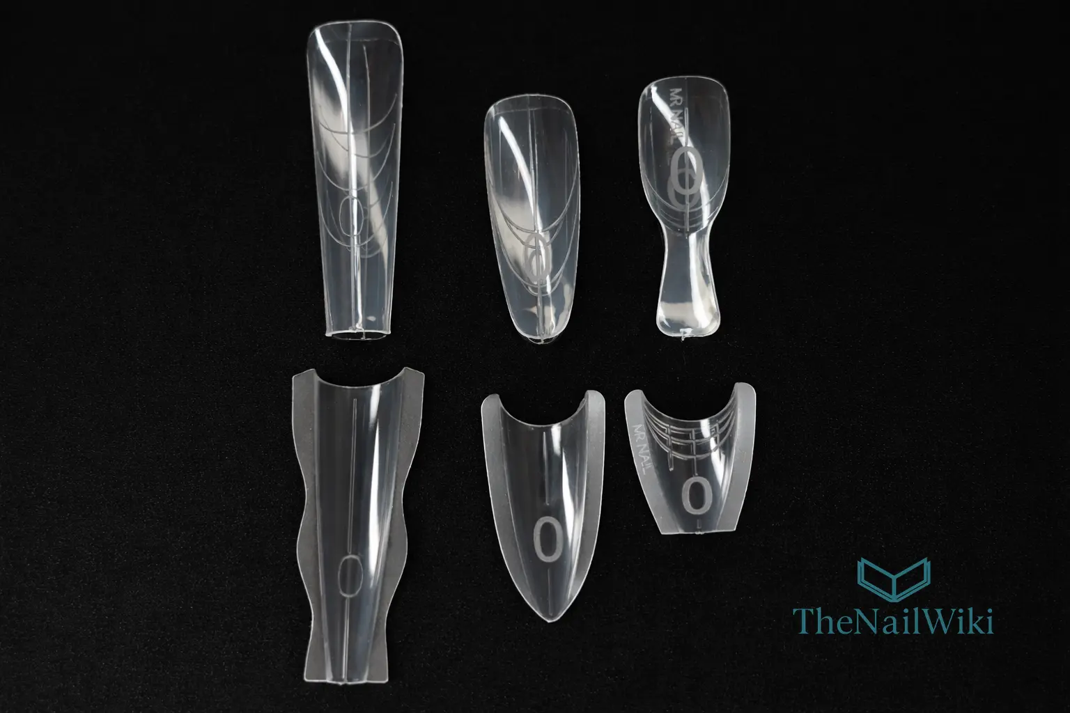 Three different Sandwich dual form systems laid out on a black background showing top moulds above and matching bottom moulds below — long almond, coffin, and a shorter shape